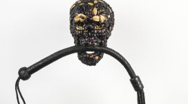 Skull with Whip, 2013, mixture of jewel beetle wing-cases, polymers, leather, 90x49x22 cm